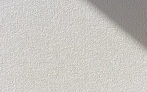 クロス張替え・壁紙張替えのイメージ画像。青みがかった壁紙のアップの写真